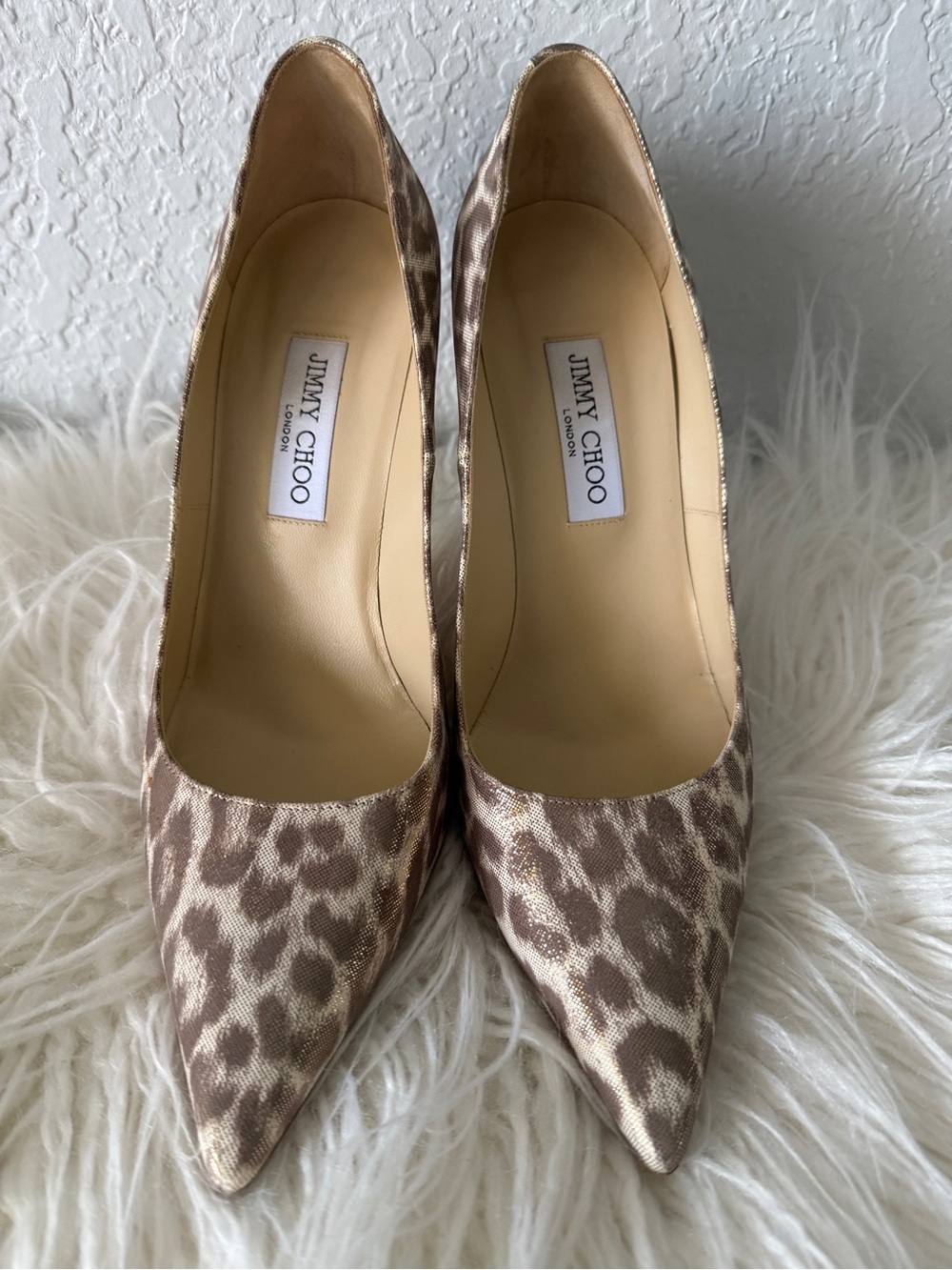 Jimmy Choo metallic leopard-print pumps with pointed toes and stiletto heels.